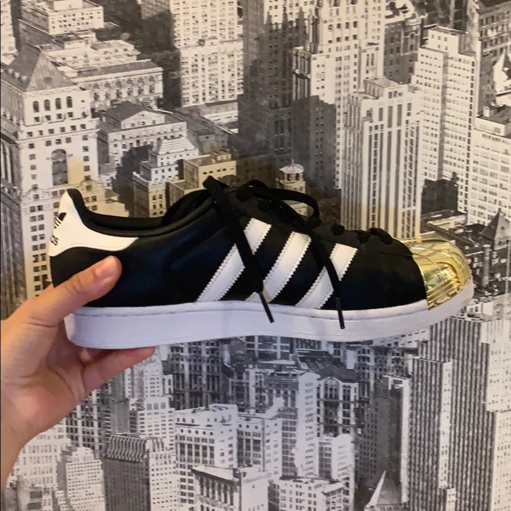 gold tipped adidas superstars size 9!
